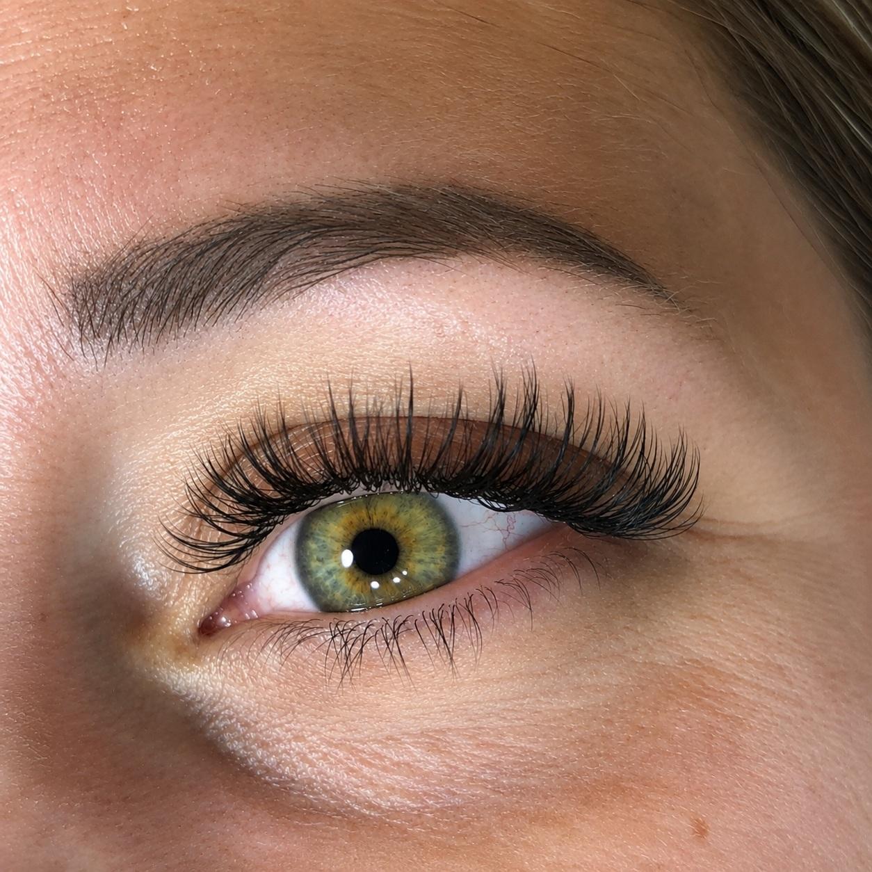 Wispy, lifted lash extensions in close-up